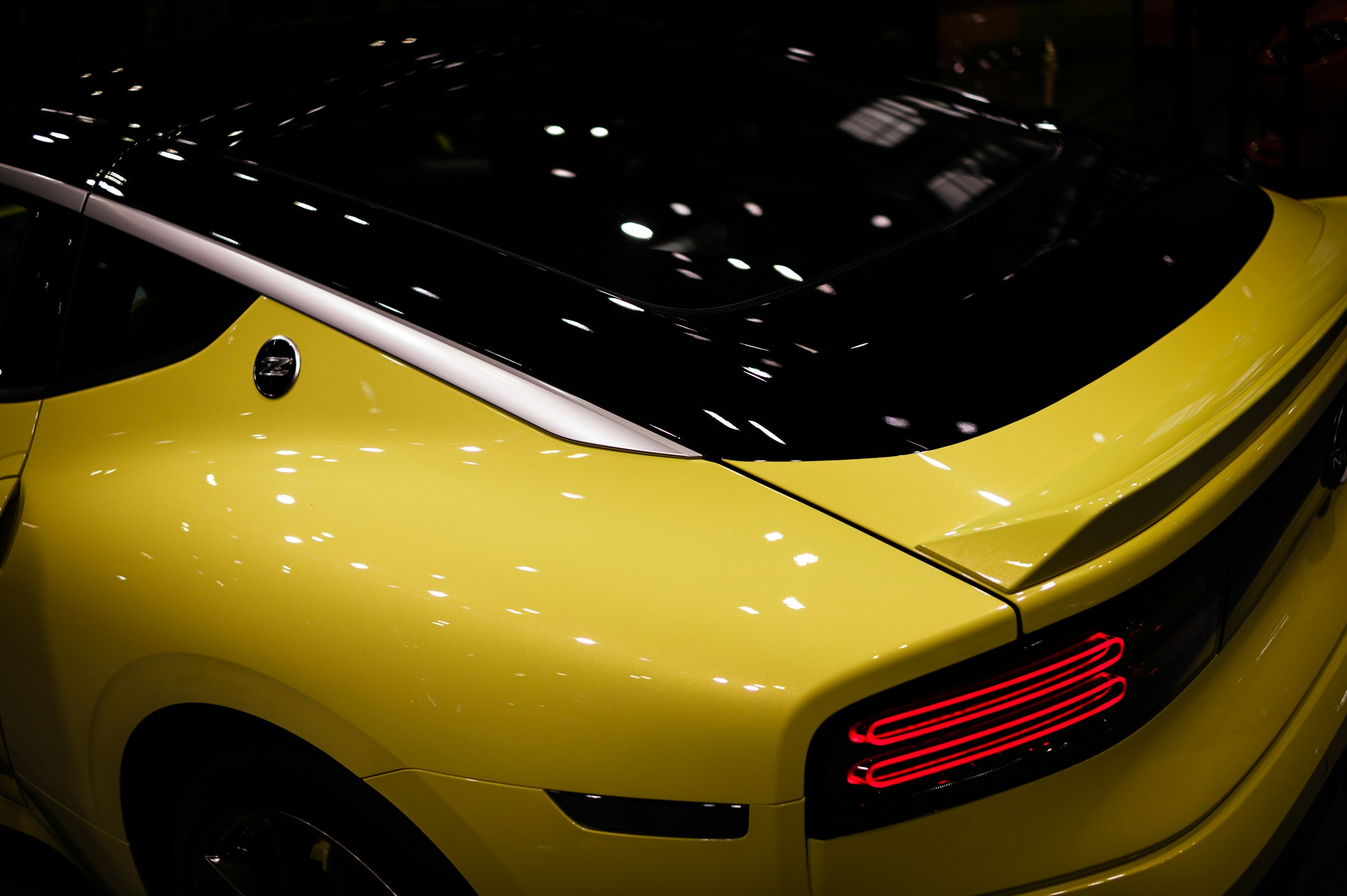 Yellow Nissan Z rear three-quarter detail
