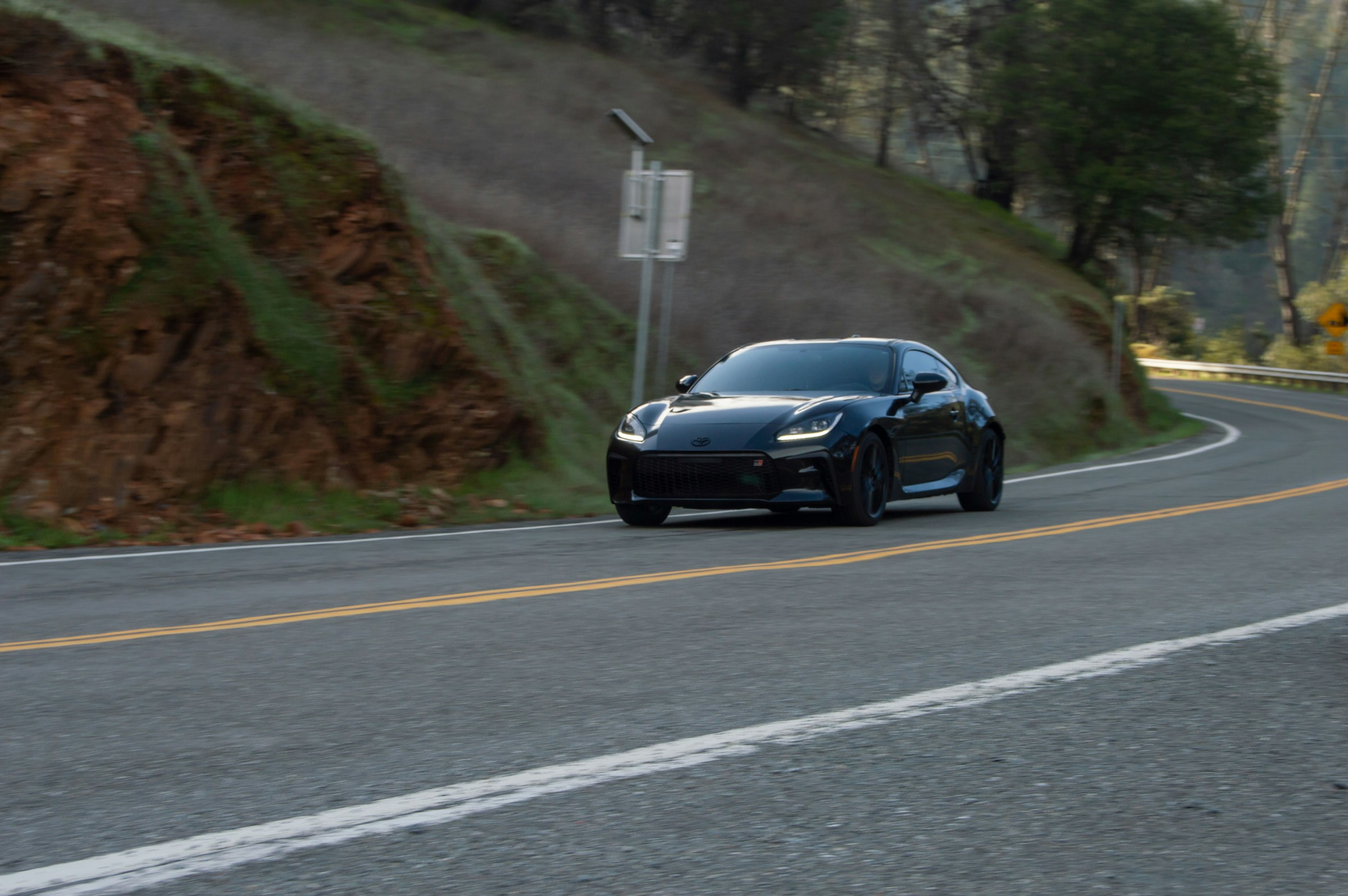 Black Toyota GR86 on a winding mountain road